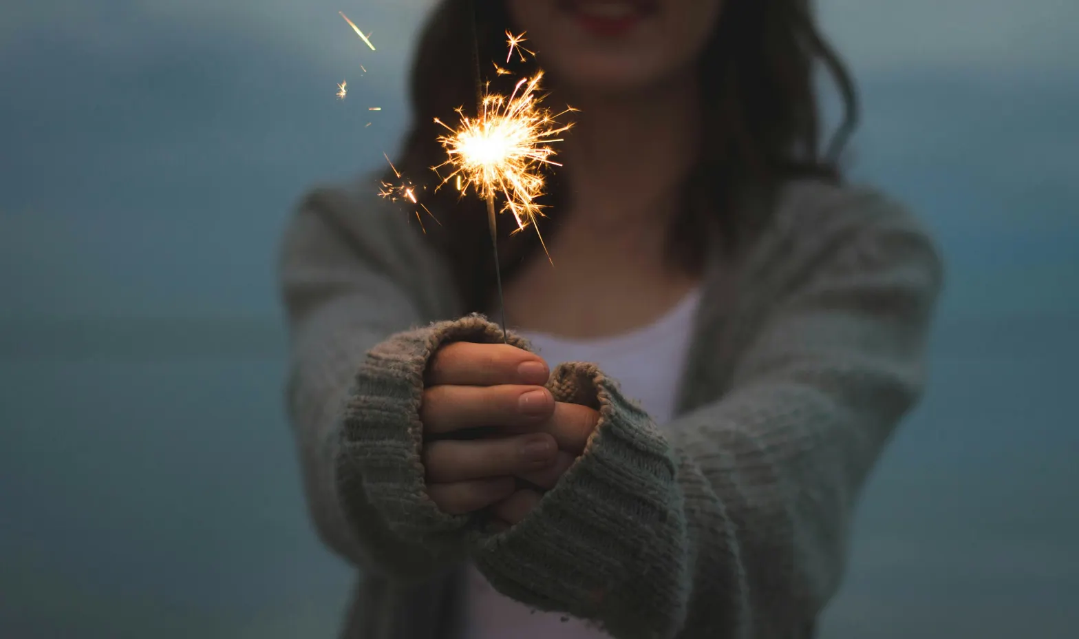 A woman holding a sparkler
