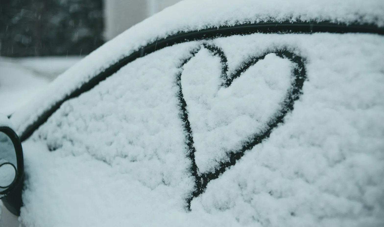 A cozy coffee shop with warm lighting and two cups of coffee on a table